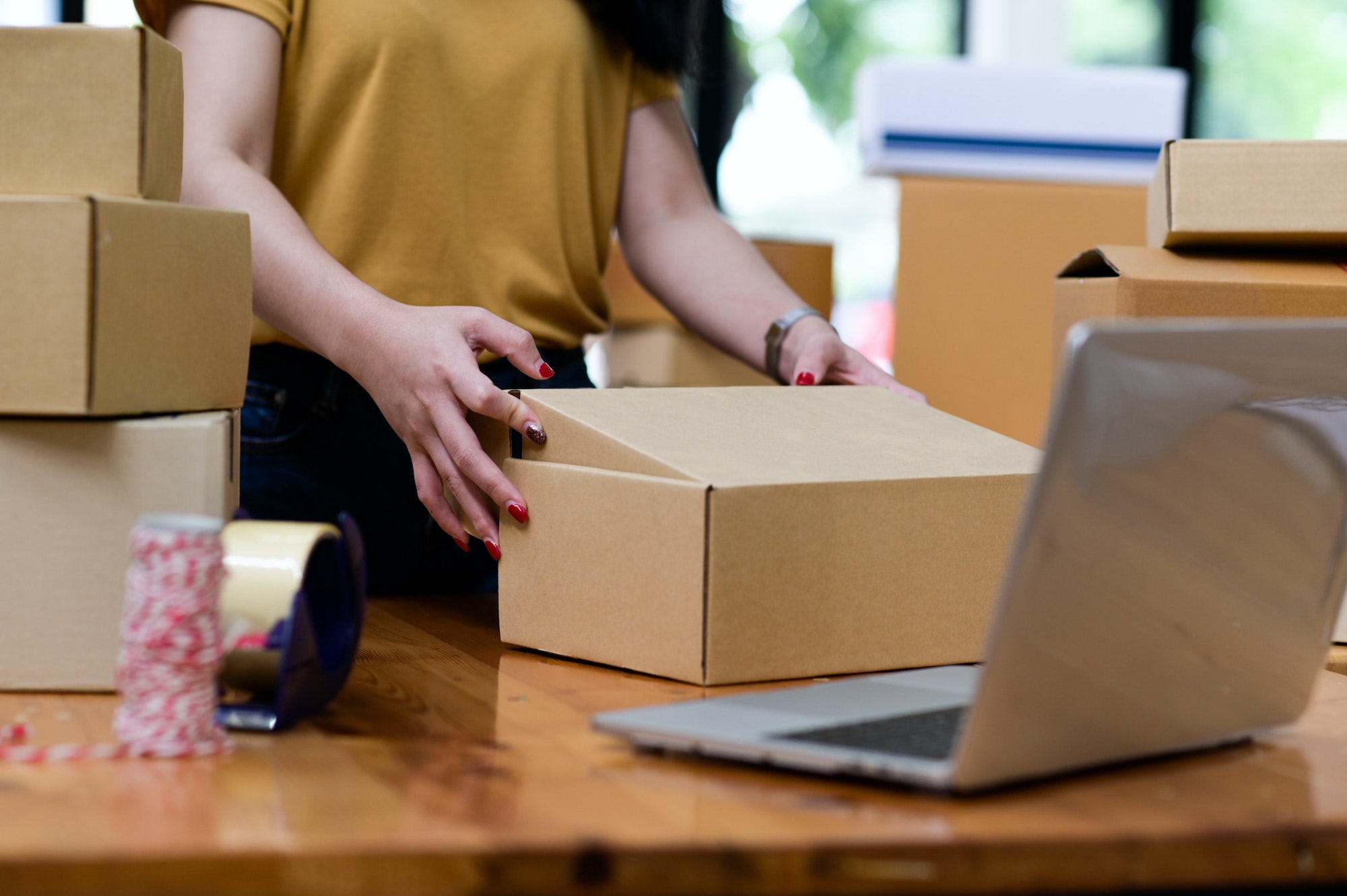 Online sellers are packing boxes for shipping, Online shopping, Shipping parcels.